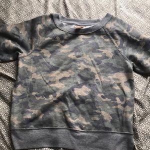 This is a camouflage long sleeve sweater.